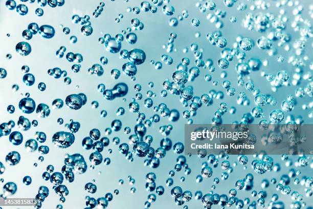 water, gel with bubbles. transparent blue moisture serum for face. hyaluronic acid. cosmetic products for makeup and skin care. beauty pattern. - humid stock pictures, royalty-free photos & images