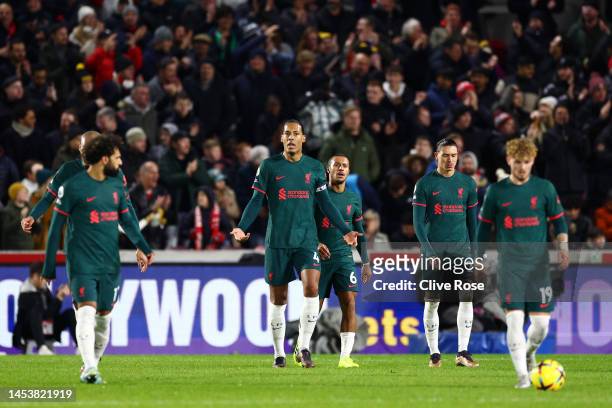 Virgil van Dijk of Liverpool looks dejected with teammates after Ibrahima Konate of Liverpool scores an own goal during the Premier League match...