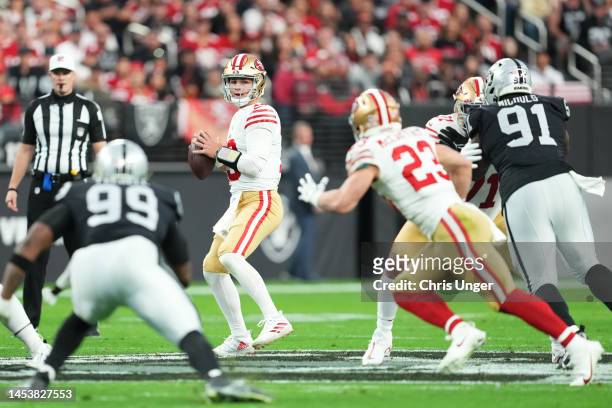 Quarterback Brock Purdy of the San Francisco 49ers looks to throw against the Las Vegas Raiders during the first half of a game at Allegiant Stadium...