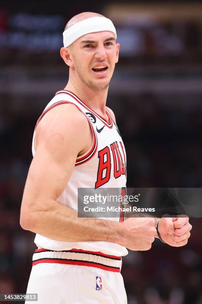 Alex Caruso of the Chicago Bulls celebrates a basket against the Cleveland Cavaliers during the first half at United Center on December 31, 2022 in...