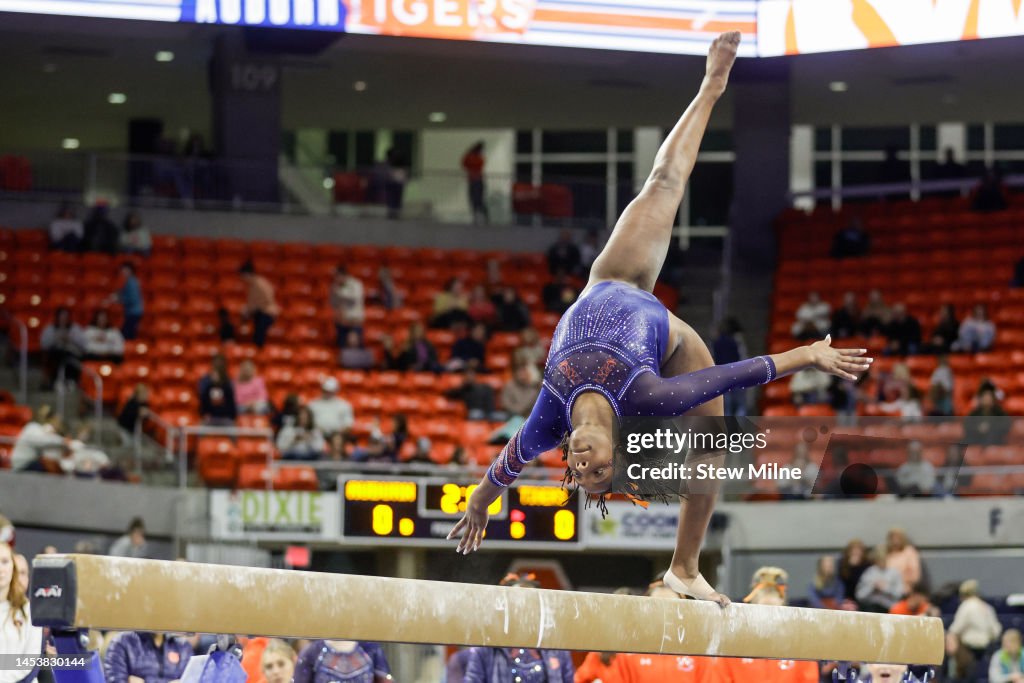 Aria Brusch of Auburn competes on the balance beam during a preview