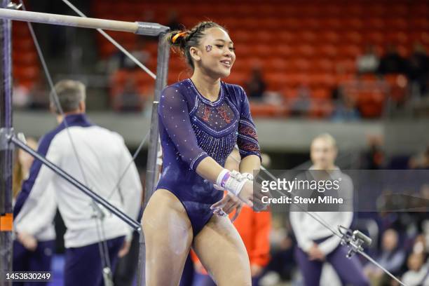 Sunisa Lee of Auburn prepares to compete on the uneven bars during a preview meet at Neville Arena on December 16, 2022 in Auburn, Alabama.