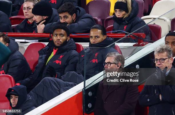 Virgil van Dijk and Joe Gomez of Liverpool look on the bench during the Premier League match between Brentford FC and Liverpool FC at Brentford...