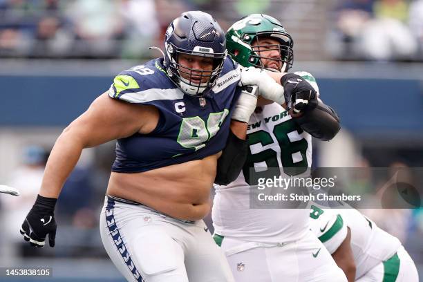 Al Woods of the Seattle Seahawks and Laurent Duvernay-Tardif of the New York Jets in action during the second quarter at Lumen Field on January 01,...