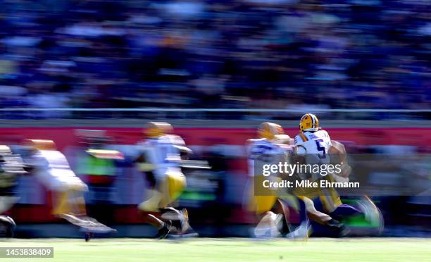 Jayden Daniels of the LSU Tigers scrambles during the Cheez-It Citrus Bowl against the Purdue Boilermakers at Camping World Stadium on January 02,...