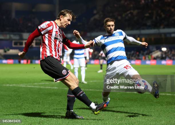 Sander Berge of Sheffield United crosses the ball while under pressure from Sam Field of Queens Park Rangers during the Sky Bet Championship between...
