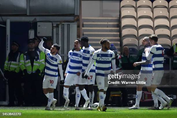 Ilias Chair of Queens Park Rangers celebrates with teammates after scoring the team's first goal during the Sky Bet Championship between Queens Park...