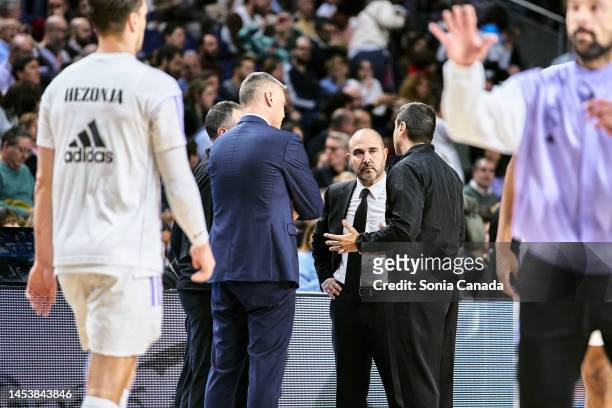 Chus Mateo coach of Real Madrid and Sarunas Jasikevicius, coach of FC Barcelona speak with the referee before the 2022/2023 Liga Endesa match between...