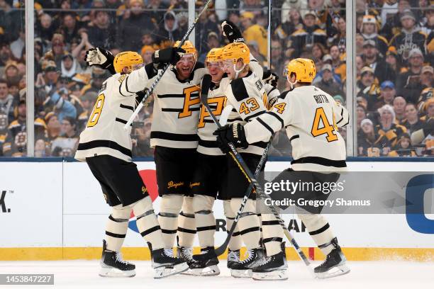 Kasperi Kapanen of the Pittsburgh Penguins celebrates with teammates after scoring a goal against the Boston Bruins during the second period in the...