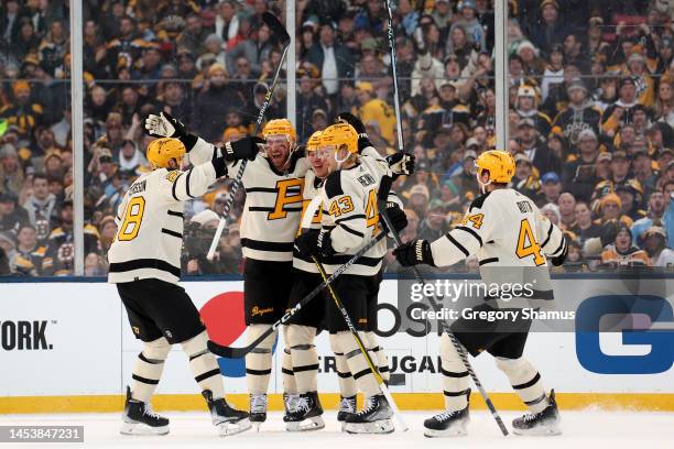 Kasperi Kapanen of the Pittsburgh Penguins celebrates with teammates after scoring a goal against the Boston Bruins during the second period in the...