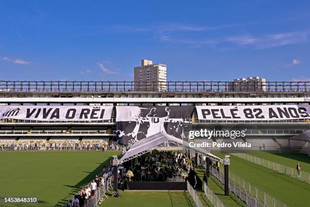 Flags remembering Pelé are displayed on the stands as mourners queue inside Vila Belmiro stadium to pay their respects to late football legend Pelé...