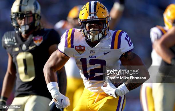 Tavion Faulk of the LSU Tigers scoreas a touchdown during the Cheez-It Citrus Bowl against the Purdue Boilermakers at Camping World Stadium on...