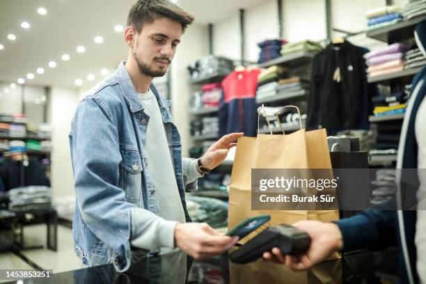 contactless payment, making payment , shop shopping , everyday shopping, men's lifestyle - how to make money online stock pictures, royalty-free photos & images