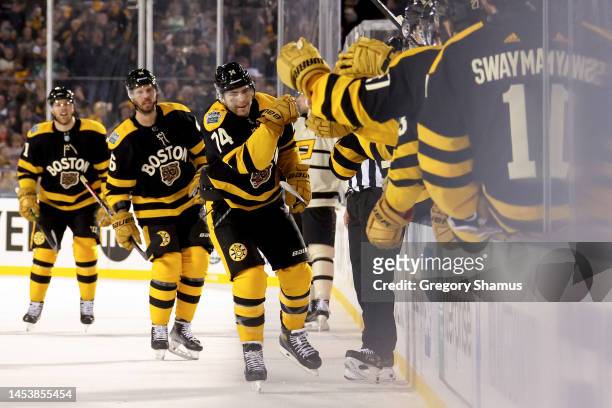 Jake DeBrusk of the Boston Bruins celebrates with teammates after scoring a goal against the Pittsburgh Penguins during the third period in the 2023...