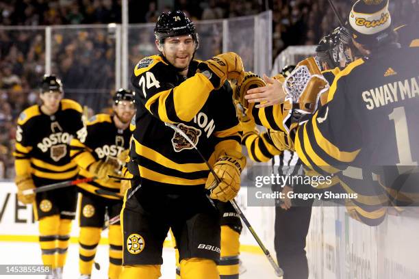 Jake DeBrusk of the Boston Bruins celebrates with teammates after scoring a goal against the Pittsburgh Penguins during the third period in the 2023...