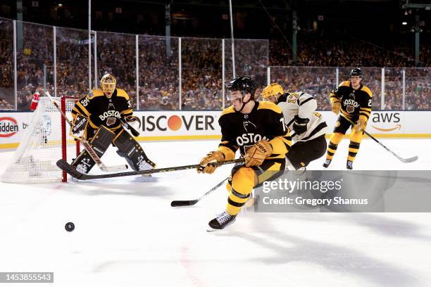 Charlie McAvoy of the Boston Bruins skates with the puck against the Pittsburgh Penguins during the third period in the 2023 Discover NHL Winter...