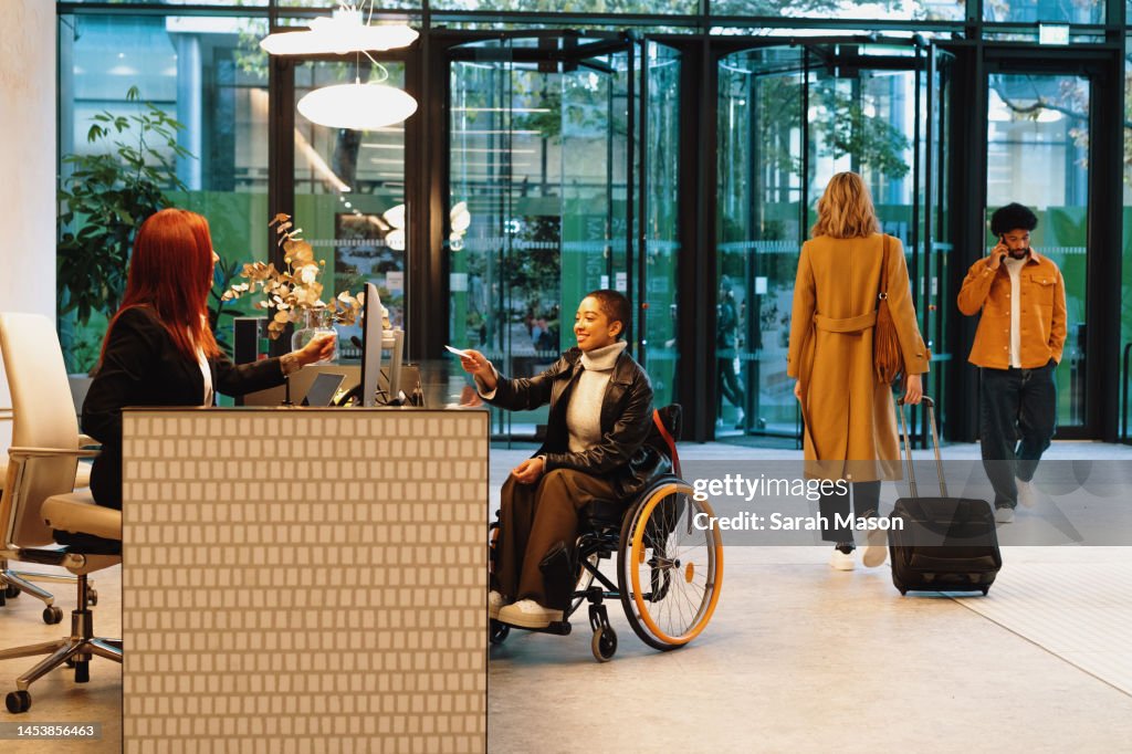 Person checking in at office reception area