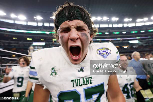Alex Bauman of the Tulane Green Wave celebrates during the trophy presentation after the Tulane Green Wave beat the USC Trojans 46-45 in the Goodyear...