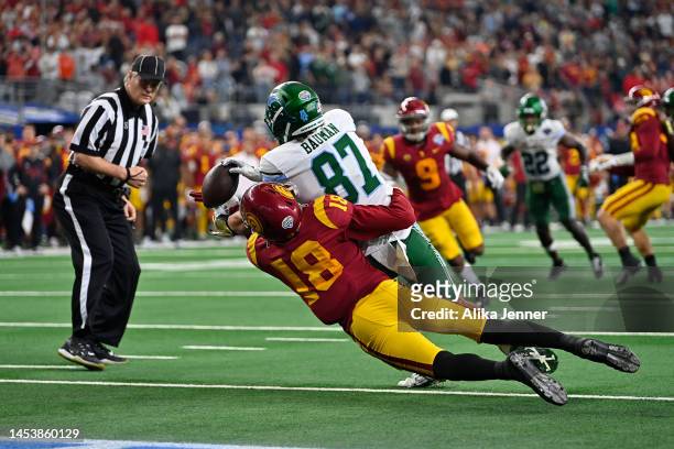 Tight end Alex Bauman of the Tulane Green Wave catches the ball for a game winning touchdown against linebacker Eric Gentry of the USC Trojans during...