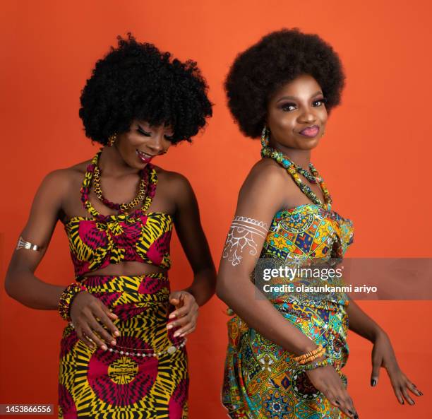 two pretty ladies on african outfit - beautiful nigerian women stock pictures, royalty-free photos & images