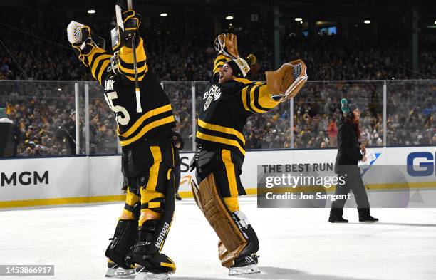 Linus Ullmark and Jeremy Swayman of the Boston Bruins celebrate after the 2023 Discover NHL Winter Classic game between the Pittsburgh Penguins and...