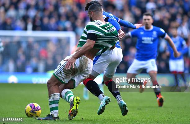Cameron Carter-Vickers of Celtic tangles with Scott Wright of Rangers during the Cinch Scottish Premiership match between Rangers FC and Celtic FC at...