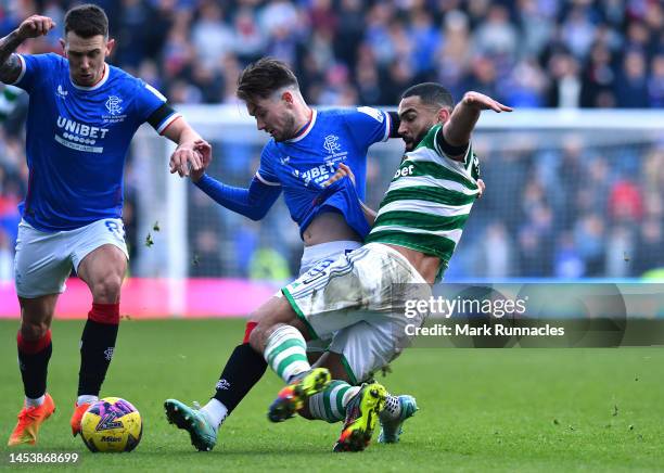 Cameron Carter-Vickers of Celtic tangles with Scott Wright of Rangers during the Cinch Scottish Premiership match between Rangers FC and Celtic FC at...