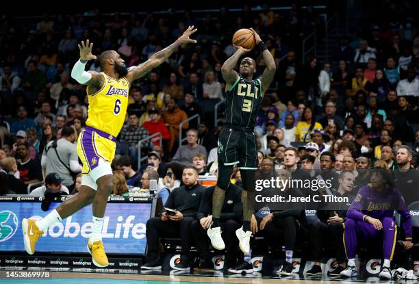 Terry Rozier of the Charlotte Hornets attempts a shot against LeBron James of the Los Angeles Lakers during the first quarter of the game at Spectrum...