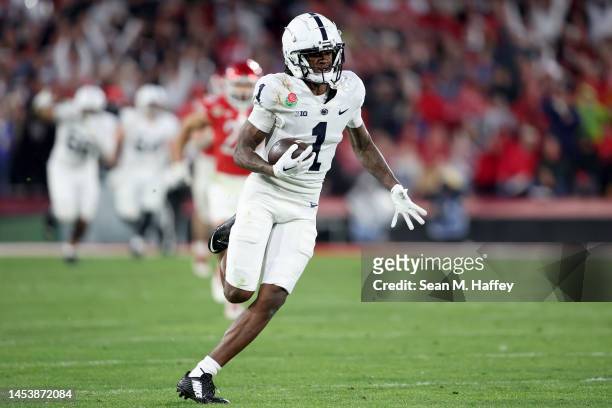 KeAndre Lambert-Smith of the Penn State Nittany Lions runs the ball after a catch to score an 88 yard touchdown against the Utah Utes during the...