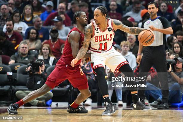 Caris LeVert of the Cleveland Cavaliers guards DeMar DeRozan of the Chicago Bulls during the first half at Rocket Mortgage Fieldhouse on January 02,...