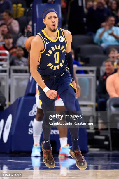 Tyrese Haliburton of the Indiana Pacers reacts after a play during the first half in the game against the Toronto Raptors at Gainbridge Fieldhouse on...