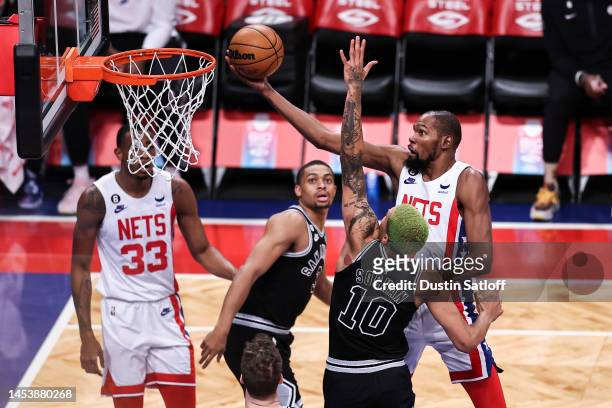 Kevin Durant of the Brooklyn Nets goes up for a layup defended by Jeremy Sochan of the San Antonio Spurs during the first quarter of the game at...