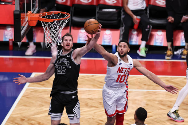 Ben Simmons of the Brooklyn Nets goes up for a rebound against Jakob Poeltl of the San Antonio Spurs during the first quarter of the game at Barclays...