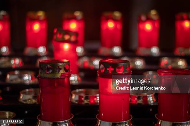 votive candles in a church in venice, italy - votive candle stock pictures, royalty-free photos & images