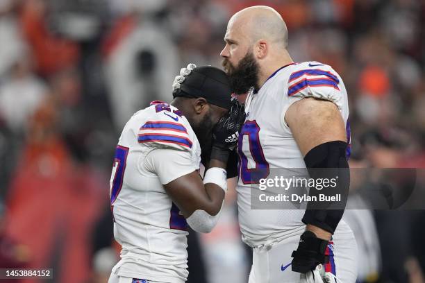 Tre'Davious White and Mitch Morse of the Buffalo Bills react to teammate Damar Hamlin collapsing after making a tackle against the Cincinnati Bengals...