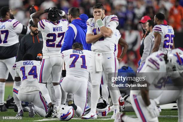 Josh Allen of the Buffalo Bills reacts after teammate Damar Hamlin collapsed following a tackle against the Cincinnati Bengals during the first...