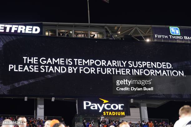 An announcement is displayed on the scoreboard after the game was temporarily suspended following the collapse of Damar Hamlin of the Buffalo Bills...