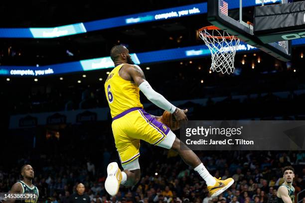 LeBron James of the Los Angeles Lakers dunks during the second half of the game against the Charlotte Hornets at Spectrum Center on January 02, 2023...