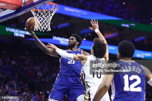 Joel Embiid of the Philadelphia 76ers shoots a lay up past Jaxson Hayes of the New Orleans Pelicans during the fourth quarter at Wells Fargo Center...