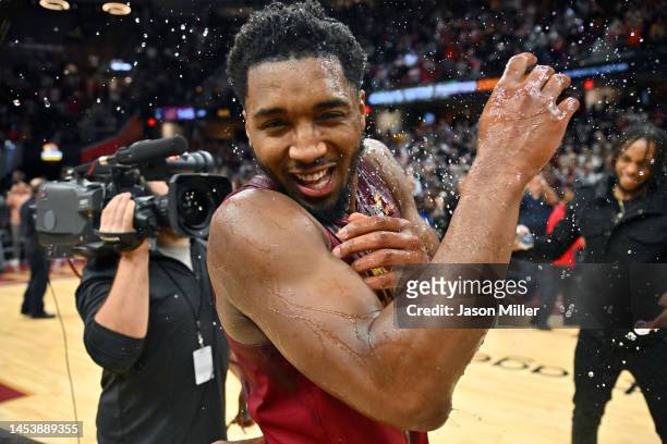 Donovan Mitchell of the Cleveland Cavaliers celebrates with his teammates after scoring a Cavaliers franchise record 71 points against the Chicago...