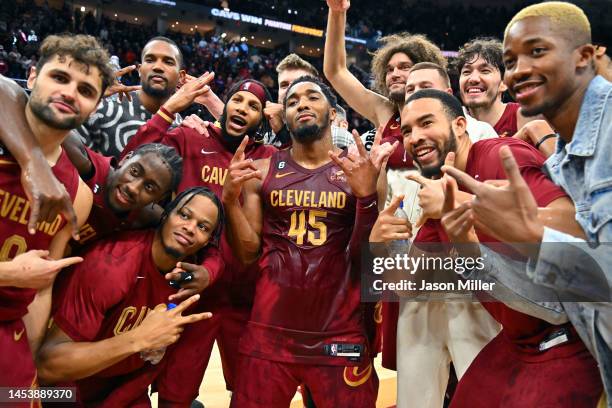 Donovan Mitchell of the Cleveland Cavaliers celebrates with his teammates after scoring a Cavaliers franchise record 71 points against the Chicago...