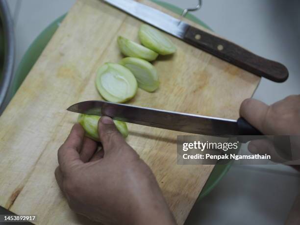 cut mangifera indica l. var. anacardiaceae small green mango - mango pickle stock pictures, royalty-free photos & images