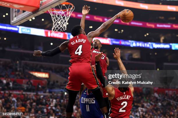Victor Oladipo of the Miami Heat blocks a shot by John Wall of the Los Angeles Clippers during the second quarter at Crypto.com Arena on January 02,...