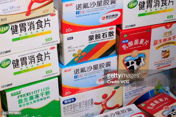 Boxes of antidiarrheal drugs Montmorillonite Powder, Norfloxacin, Jianwei Xiaoshi Tablets are seen on January 2, 2023 in Anyang, Henan Province of...