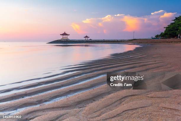 a balinese pagoda on the beach at sanur, bali, indonesia - sanur stock pictures, royalty-free photos & images