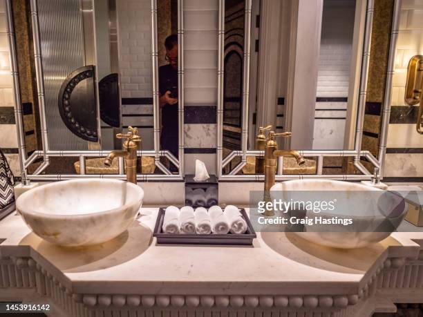 vintage gold brass mirror faucet and sink in old-fashioned bathroom art deco style - art deco home stock pictures, royalty-free photos & images
