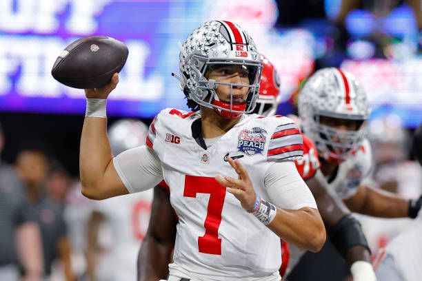 Stroud of the Ohio State Buckeyes drops back to pass during the first half against the Georgia Bulldogs in the Chick-fil-A Peach Bowl at...
