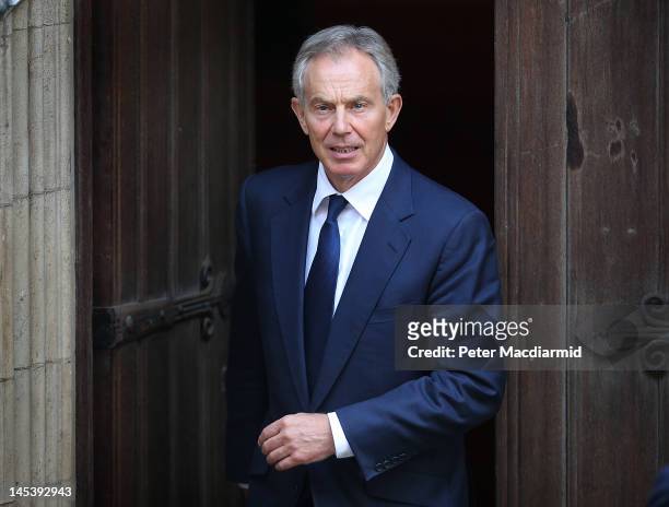 Former Prime Minister Tony Blair leaves The Royal Courts of Justice by a side door after giving evidence to The Leveson Inquiry on May 28, 2012 in...