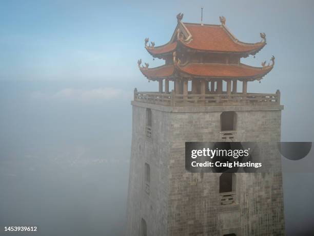 sa pa, hanoi, vietnam - fansipan temple tower pagoda with fog, mist and cloud - bucket list stock pictures, royalty-free photos & images
