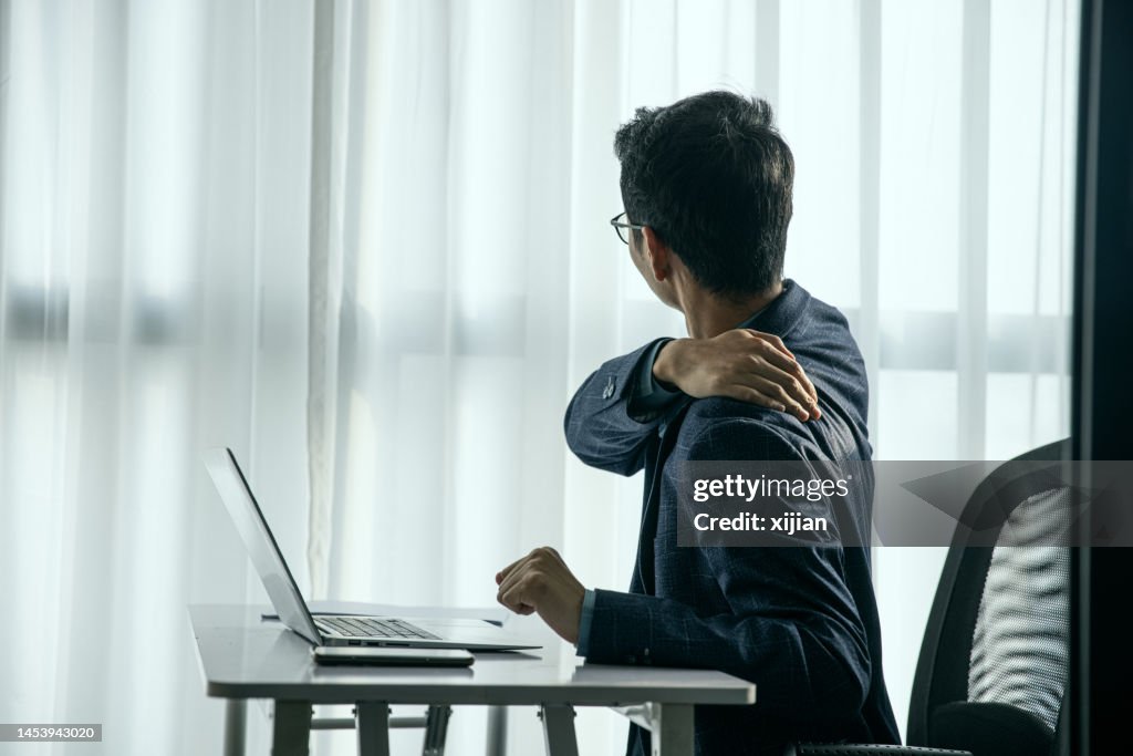 Businessman shoulder is in pain